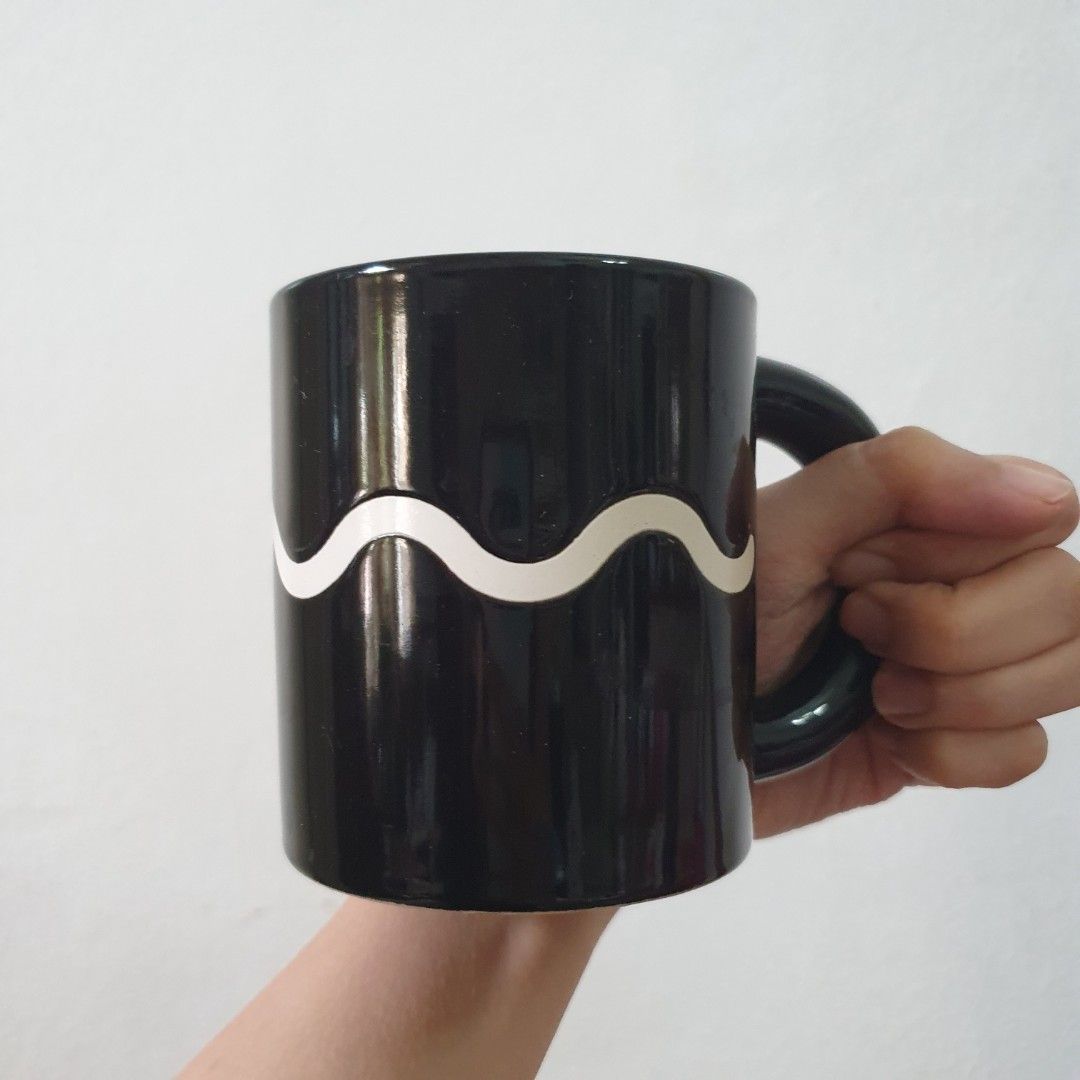 Black wave mug coffee cup (Category: Dinnerware & Cutlery) located in Paranaque City. Submitted by cobien (Listing ID 1461392791, Image 3). Description: - Stylish black coffee mug with a unique wave design. - Brand: Adam & Eve Tachikichi Inc. - Ideal for coffee, tea, or any favorite beverage. - Classic and elegant design..