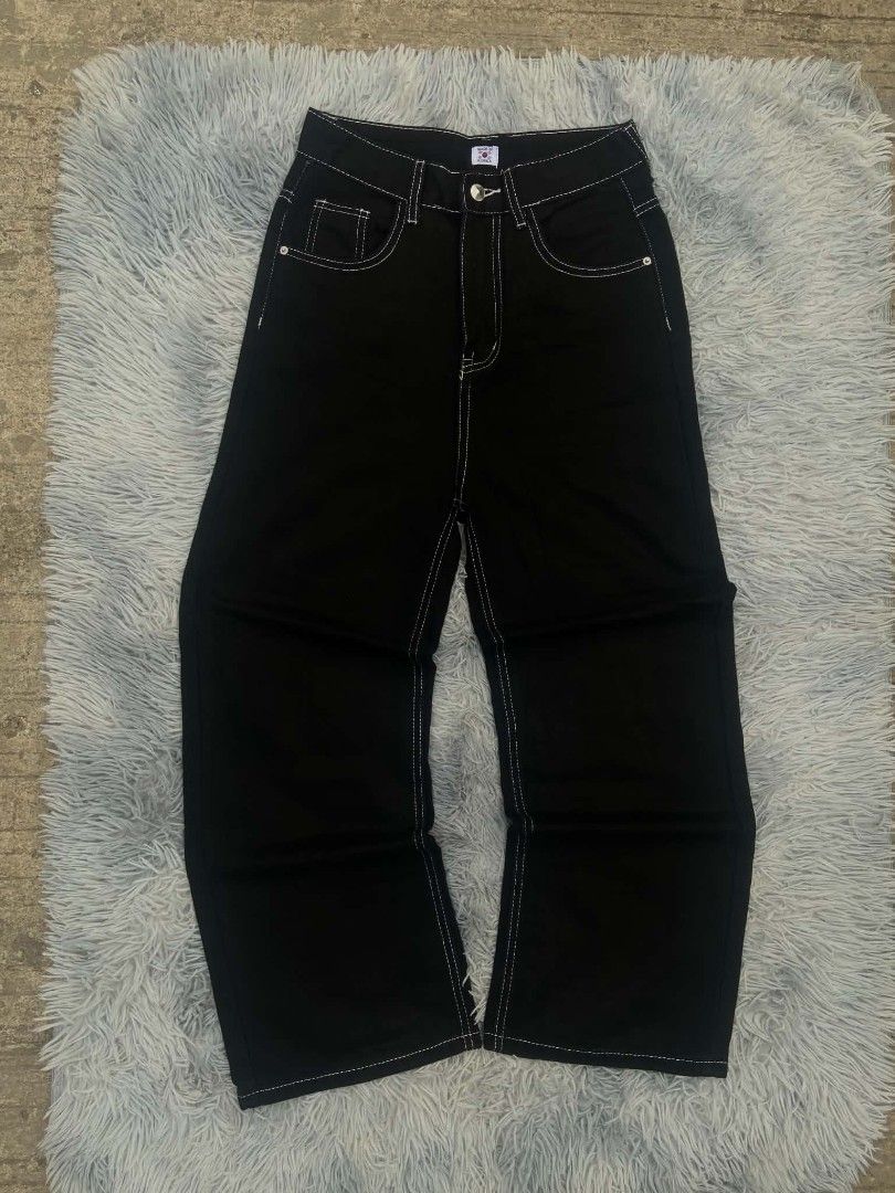 Black Wide Leg Jeans with White Stitching (Category: Jeans) located in Lianga. Submitted by arwthrifts (Listing ID 1461467883, Image 1). Description: - Black wide leg jeans - Features contrast white stitching throughout - High-waisted fit - Classic five-pocket styling - Button and zip closure - Great for casual wear - Versatile wardrobe piece.