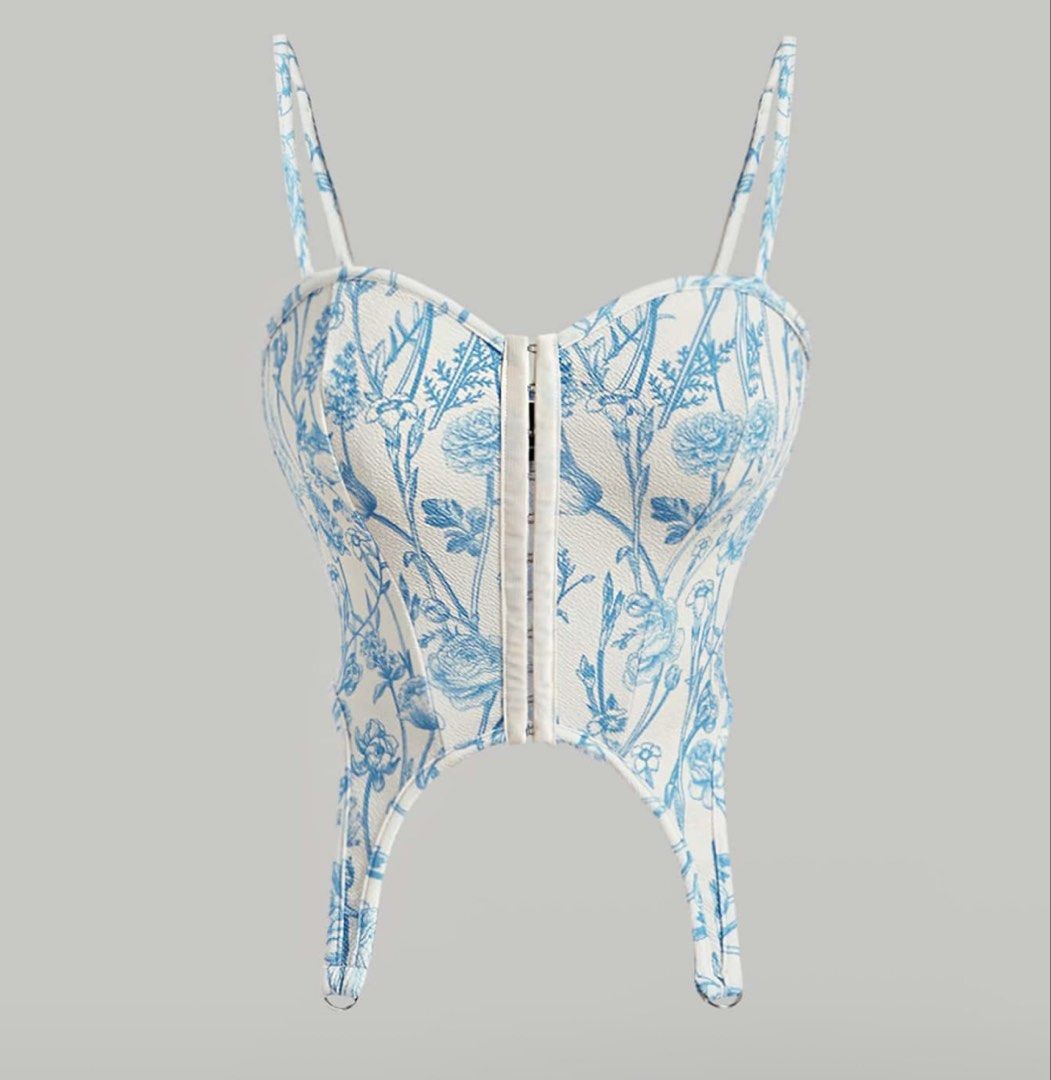 Blue Floral Corset Top with Front Clasp (Category: Others Tops) located in Quezon City. Submitted by a10as (Listing ID 1461380836, Image 1). Description: - Adorable blue and white floral print corset top - Features adjustable straps for a perfect fit - Convenient front clasp closure - Versatile styling: pairs beautifully with jeans or skirts - Ideal for nights out or special occasions.