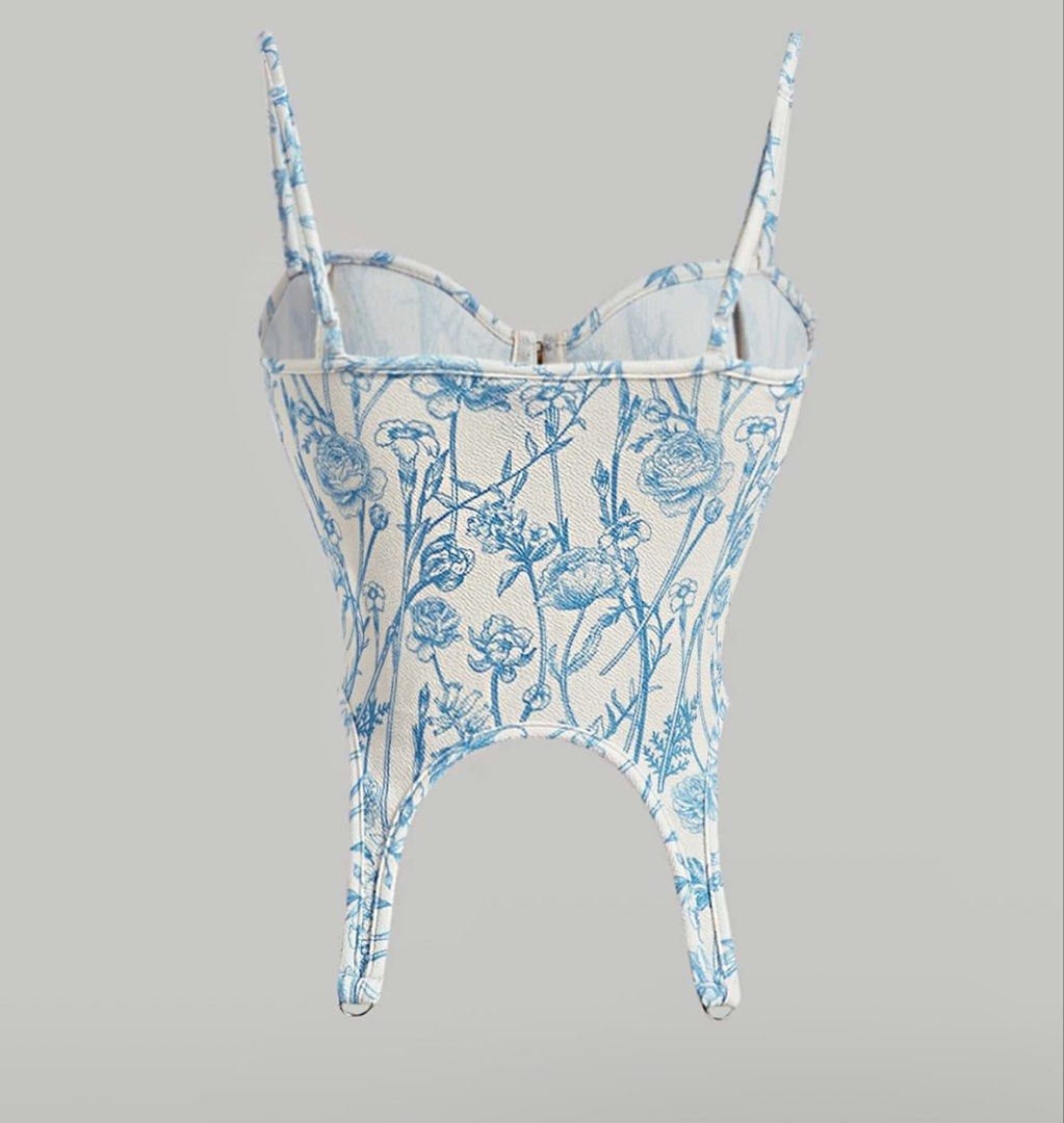 Blue Floral Corset Top with Front Clasp (Category: Others Tops) located in Quezon City. Submitted by a10as (Listing ID 1461380836, Image 2). Description: - Adorable blue and white floral print corset top - Features adjustable straps for a perfect fit - Convenient front clasp closure - Versatile styling: pairs beautifully with jeans or skirts - Ideal for nights out or special occasions.