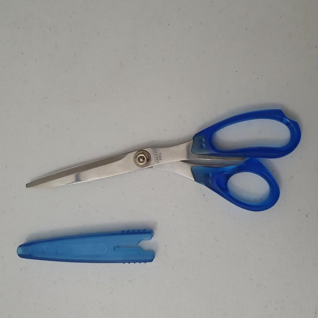 Blue Stainless scissors with cover (Category: Stationery & School Supplies) located in Paranaque City. Submitted by cobien (Listing ID 1461425858, Image 3). Description: - Blue scissors with a protective cover - Made of stainless steel for durability - Approximately 8.5 inches in length - Ideal for various cutting tasks - Safe and easy to handle.