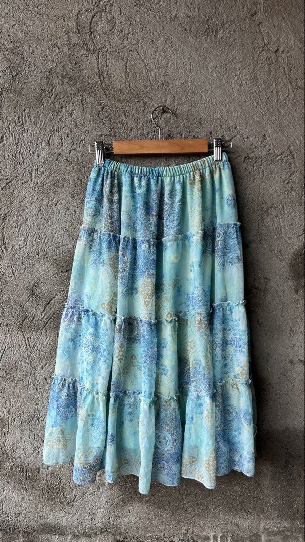 Blue Tiered Boho Maxi Skirt (Category: Skirts) located in Cabuyao City. Submitted by bulandos (Listing ID 1461426510, Image 2). Description: - Light and flowy tiered maxi skirt - Beautiful blue and tan paisley-inspired print - Comfortable elastic waistband - Versatile for casual or dressed-up looks - Ideal for summer days.