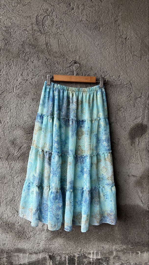 Blue Tiered Boho Maxi Skirt (Category: Skirts) located in Cabuyao City. Submitted by bulandos (Listing ID 1461426510, Image 1). Description: - Light and flowy tiered maxi skirt - Beautiful blue and tan paisley-inspired print - Comfortable elastic waistband - Versatile for casual or dressed-up looks - Ideal for summer days.