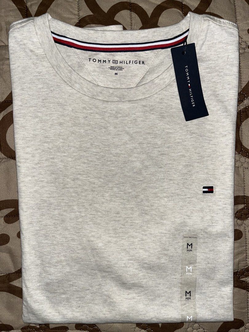 BNEW Tommy Hilfiger Cotton Tee (Beige) (Category: Tshirts & Polo Shirts ) located in Cavite. Submitted by ssfinds_ (Listing ID 1461459214, Image 2). Description: BNEW Tommy Hilfiger Cotton Tee (Beige) Size: Medium Condition: Brandnew w/ hangtags, no any issues Dimension: 28L x 20W (in inches) Location: Intramuros, Manila Courier: J&T, LBC, or Lalamove Can do meetup, only at SM Manila. If pickup, only at Intramuros. Price is only SLIGHTLY negotiab