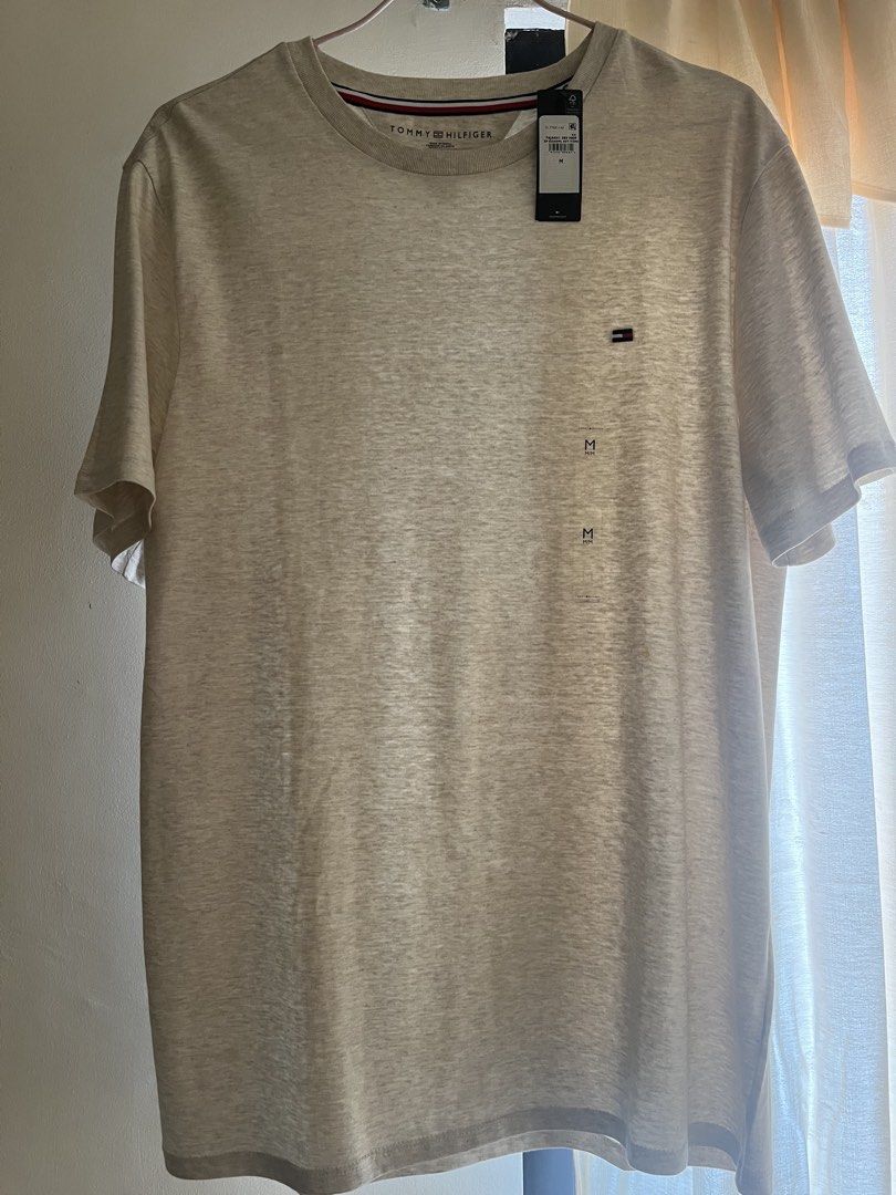 BNEW Tommy Hilfiger Cotton Tee (Beige) (Category: Tshirts & Polo Shirts ) located in Cavite. Submitted by ssfinds_ (Listing ID 1461459214, Image 1). Description: BNEW Tommy Hilfiger Cotton Tee (Beige) Size: Medium Condition: Brandnew w/ hangtags, no any issues Dimension: 28L x 20W (in inches) Location: Intramuros, Manila Courier: J&T, LBC, or Lalamove Can do meetup, only at SM Manila. If pickup, only at Intramuros. Price is only SLIGHTLY negotiab