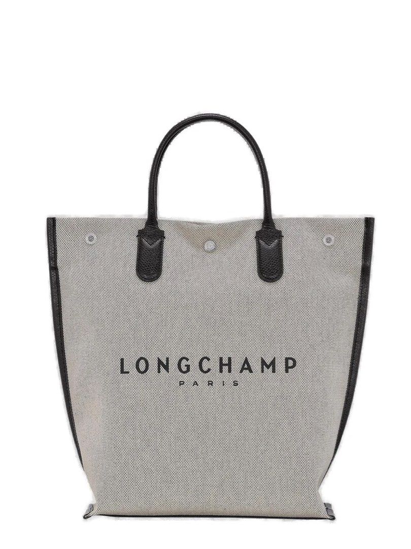 (Brand New)Longchamp Essential Medium Top Handle Bag (Category: Tote Bags) located in Makati City. Submitted by bb5966 (Listing ID 1461518536, Image 1). Description: Structured tote bag silhouette Open-top construction Double top handles Light woven body Black leather trim Black leather handles Front logo print Contrasting black detailing Details 100% Calf Leather, 100% Polyurethane Dimensions: Width: 28.5cm, Height: 37.5cm, Depth: 9.5cm.