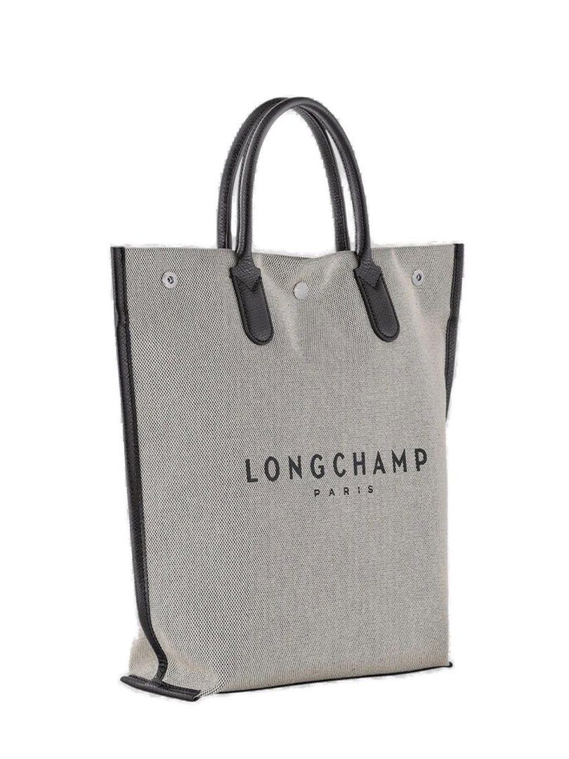 (Brand New)Longchamp Essential Medium Top Handle Bag (Category: Tote Bags) located in Makati City. Submitted by bb5966 (Listing ID 1461518536, Image 3). Description: Structured tote bag silhouette Open-top construction Double top handles Light woven body Black leather trim Black leather handles Front logo print Contrasting black detailing Details 100% Calf Leather, 100% Polyurethane Dimensions: Width: 28.5cm, Height: 37.5cm, Depth: 9.5cm.