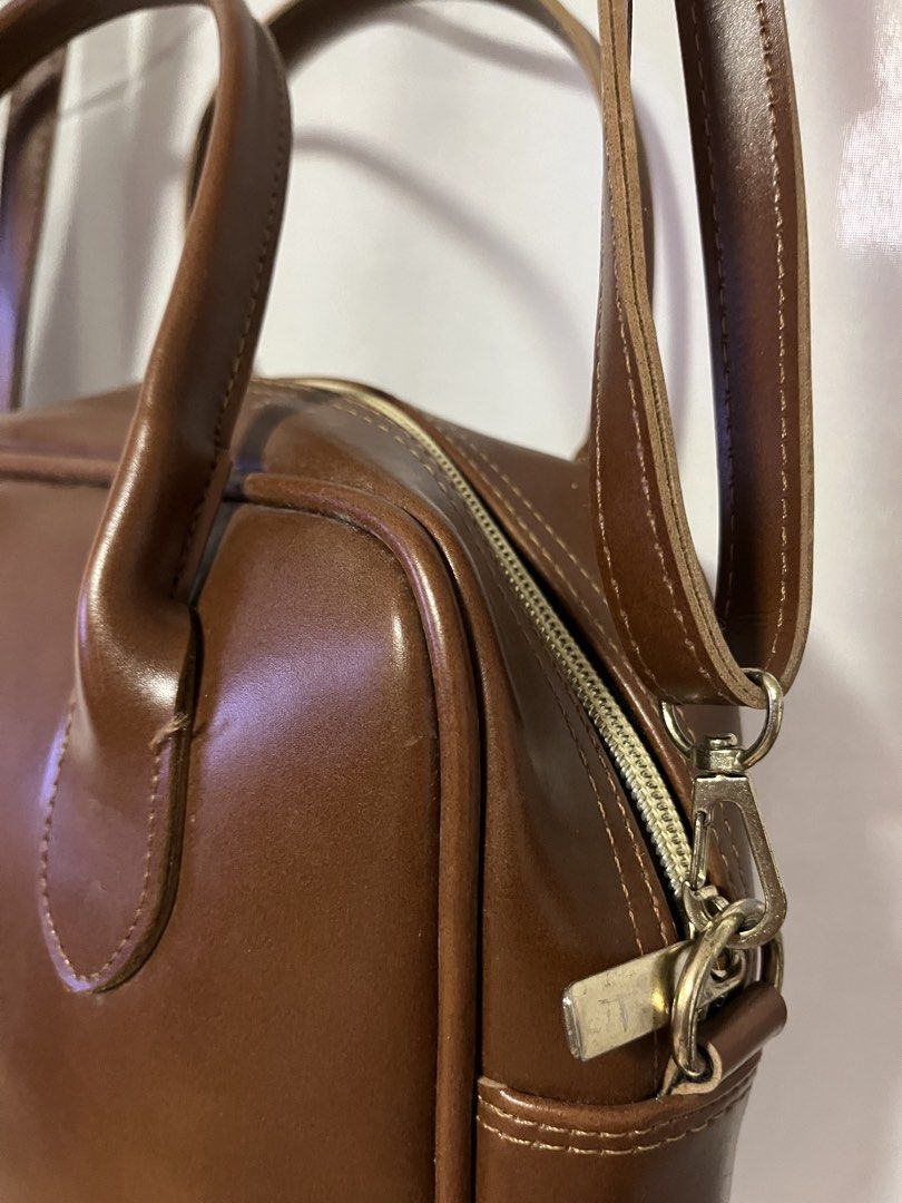 Brown Faux Leather Top Handle Bag with Strap (Category: Shoulder Bags) located in Quezon City. Submitted by rebagged.mnl (Listing ID 1461405742, Image 3). Description: - Classic brown handbag - Faux leather material - Top handles - Detachable shoulder strap - Zipper closure - Ideal for everyday use - Fits your essentials - Simple and functional design.