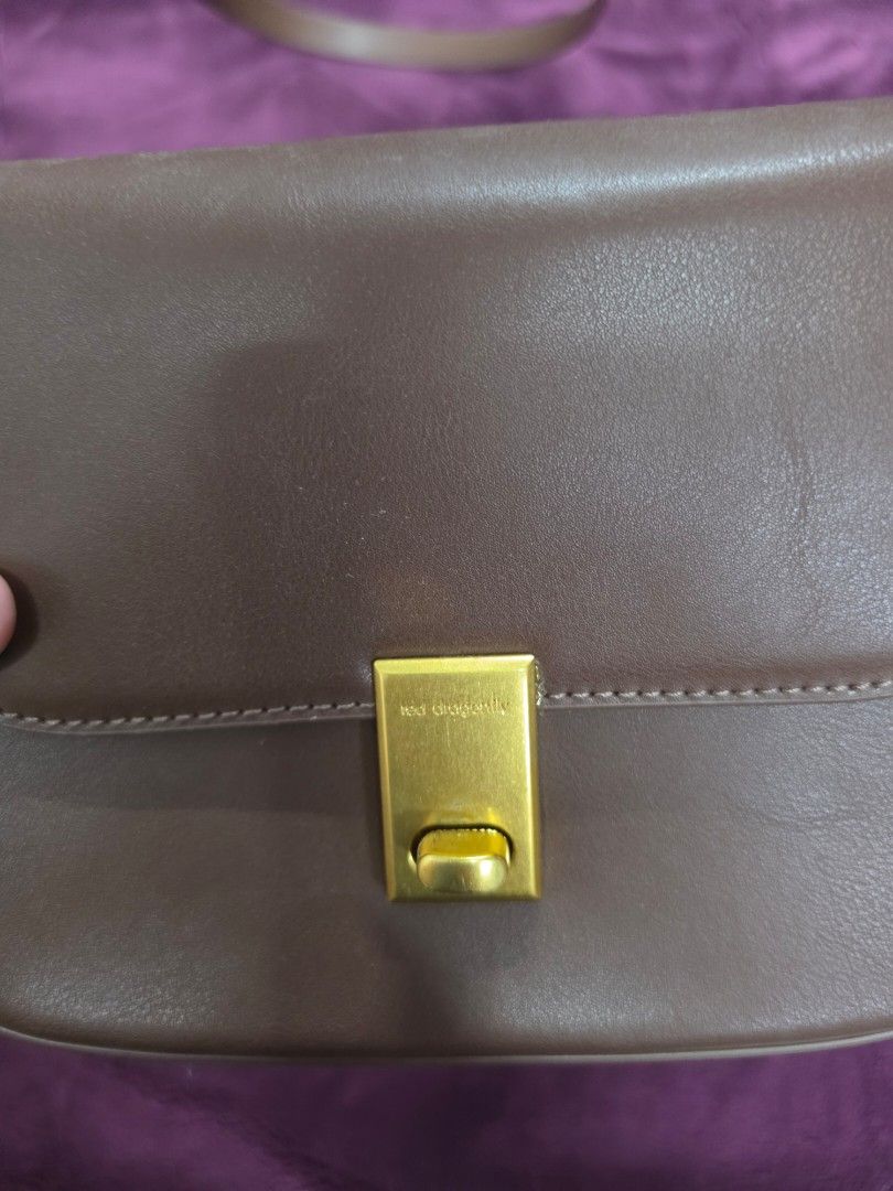 Brown Shoulder Bag with Gold Clasp (Category: Shoulder Bags) located in Manila. Submitted by f3v1nadump (Listing ID 1461377432, Image 2). Description: - Cute brown shoulder bag - Gold clasp closure - Adjustable strap - Interior zippered pocket - Faux leather material - Ideal for everyday use - Fits phone, wallet, and keys.