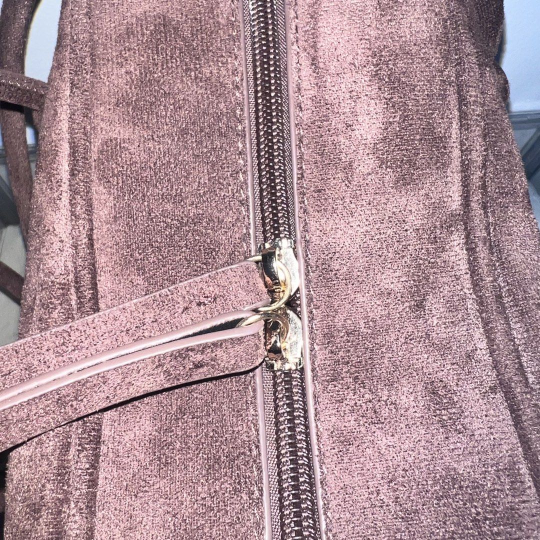 Brown Suede Shoulder Bag (Category: Shoulder Bags) located in Lubao. Submitted by ad_apparel (Listing ID 1461533268, Image 2). Description: - Cute brown shoulder bag - Made of soft suede material - Main zip compartment - Inner zip pocket - Great for everyday use PRELOVED🫶🏻 RFS: Decluttering Original price Php 998.