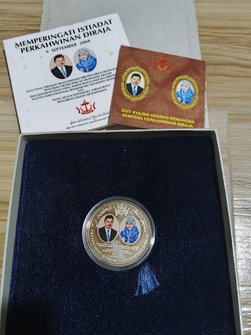Brunei Royal Wedding Commemorative Coin 2004 (Category: Currency) located in Alfonso. Submitted by caleb_and_mina (Listing ID 1461467366, Image 2). Description: - Commemorative coin from Brunei - Celebrates the Royal Wedding in September 2004 - Features portraits of the royal couple - Comes in a presentation box - Includes accompanying certificates and information booklets - Ideal for coin collectors.