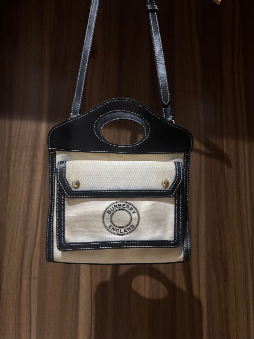 Burberry Pocket Bag Canvas Leather (Category: Luxury Bags & Wallets) located in Quezon City. Submitted by biboobeary (Listing ID 1461532850, Image 2). Description: Issue: A bit dirty - Burberry Pocket Bag - Material: Canvas and Leather - Made in Italy - Includes authenticity cards and dust bag - Features interior Burberry logo - Ideal for everyday use.