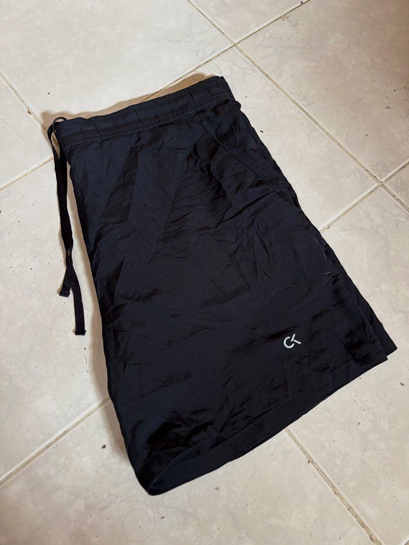Calvin Klein Black Drawstring Shorts (Category: Shorts) located in Manila. Submitted by manifest_05 (Listing ID 1461329375, Image 1). Description: - Brand: Calvin Klein - Color: Black - Features: Elastic waistband with drawstring - Design: Subtle CK logo on the side - Ideal for: Lounging, casual wear.