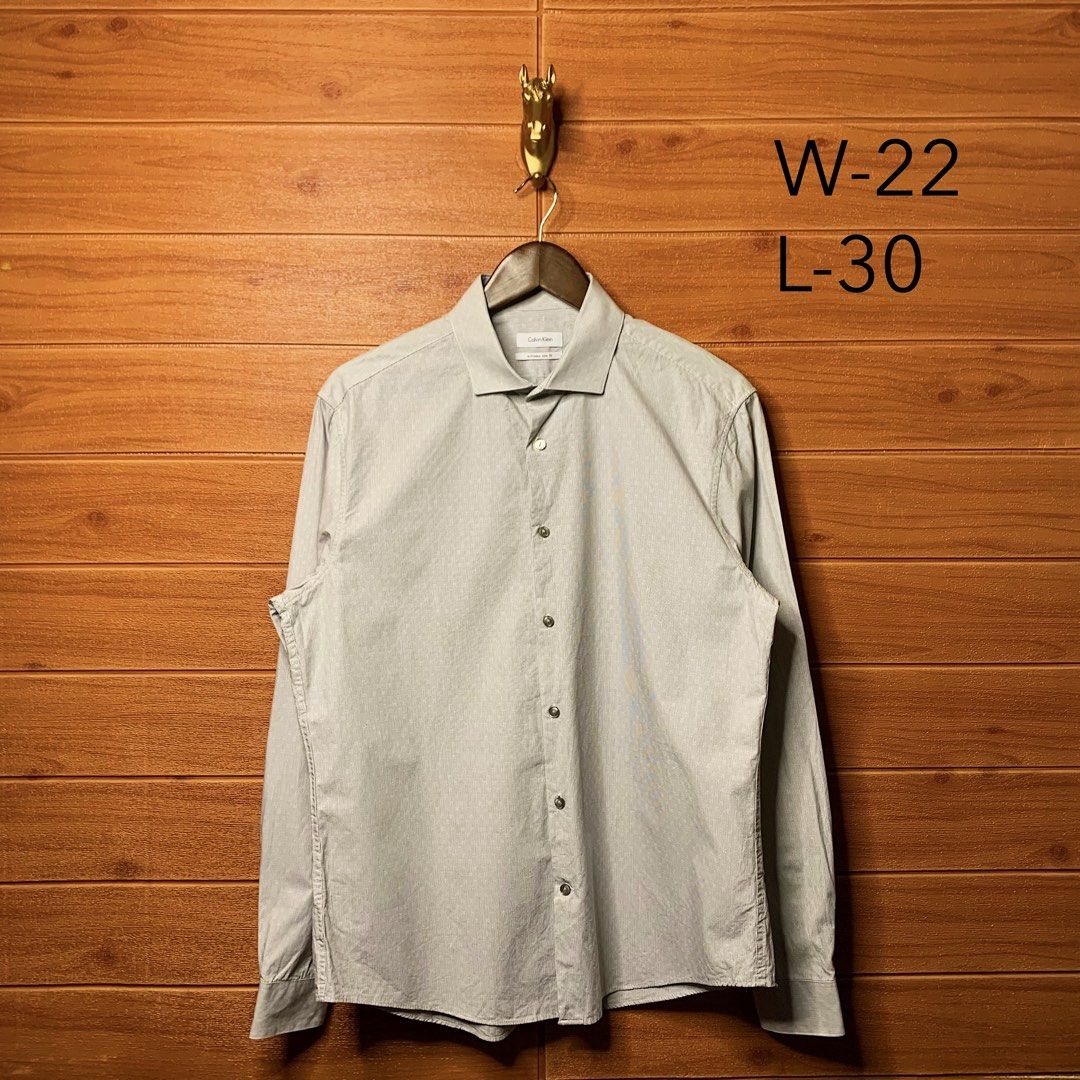 Calvin Klein Button down (Category: Formal Shirts) located in Quezon City. Submitted by donklasiko (Listing ID 1461558245, Image 2). Description: Condition: 9.5+/10 Pristine condition Issue: non Refer to the dimension 🤗 PM FOR MORE DETAILS NO RETURN, NO EXCHANGE & NO REFUND! ✅I ALSO ACCEPT TRADE/SWAP TO ANYTHING JUST DROP YOUR OFFER Please manage your expectations, this is a secondhand item. What you see is what you get 😊 💵MOP: GCASH, BDO or C