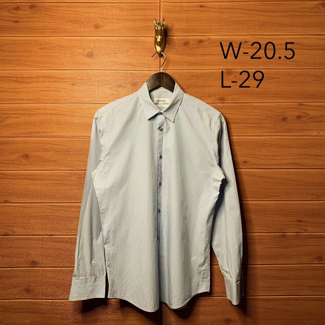 Calvin Klein Striped Button down (Category: Formal Shirts) located in Quezon City. Submitted by donklasiko (Listing ID 1461555021, Image 2). Description: Condition: 9.5+/10 Pristine condition Issue: non Refer to the dimension 🤗 PM FOR MORE DETAILS NO RETURN, NO EXCHANGE & NO REFUND! ✅I ALSO ACCEPT TRADE/SWAP TO ANYTHING JUST DROP YOUR OFFER Please manage your expectations, this is a secondhand item. What you see is what you get 😊 💵MOP: GCASH, 