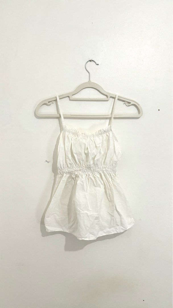 Cami Cinch-Waist Peplum Top (Category: Sleeveless) located in Caloocan City. Submitted by buymethisandthat (Listing ID 1461402965, Image 1). Description: ✨ Cami Cinch-Waist Peplum Top - ₱99 📌 CONDITION • Condition: 8.5/10 • Flaws: Minor storage creasing/wrinkling; 📏 SIZE • Tag Size: No size tag • Recommended: Fits Extra Small to Medium (Smocked Elastic Waist).