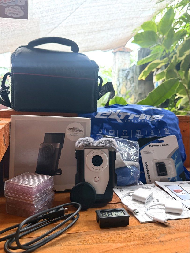 Canon PowerShot V10 Camera Kit with Accessories (Category: Cameras) located in Manila. Submitted by erunmiqlo.26 (Listing ID 1461540721, Image 3). Description: Selling a Canon PowerShot V10 camera. It has a 6.6mm F2.8 lens. Comes with a SmallRig cage and a fuzzy microphone cover. Also includes a camera bag, memory card, USB cables, and charger. Everything you need to start shooting. All items are in the box..