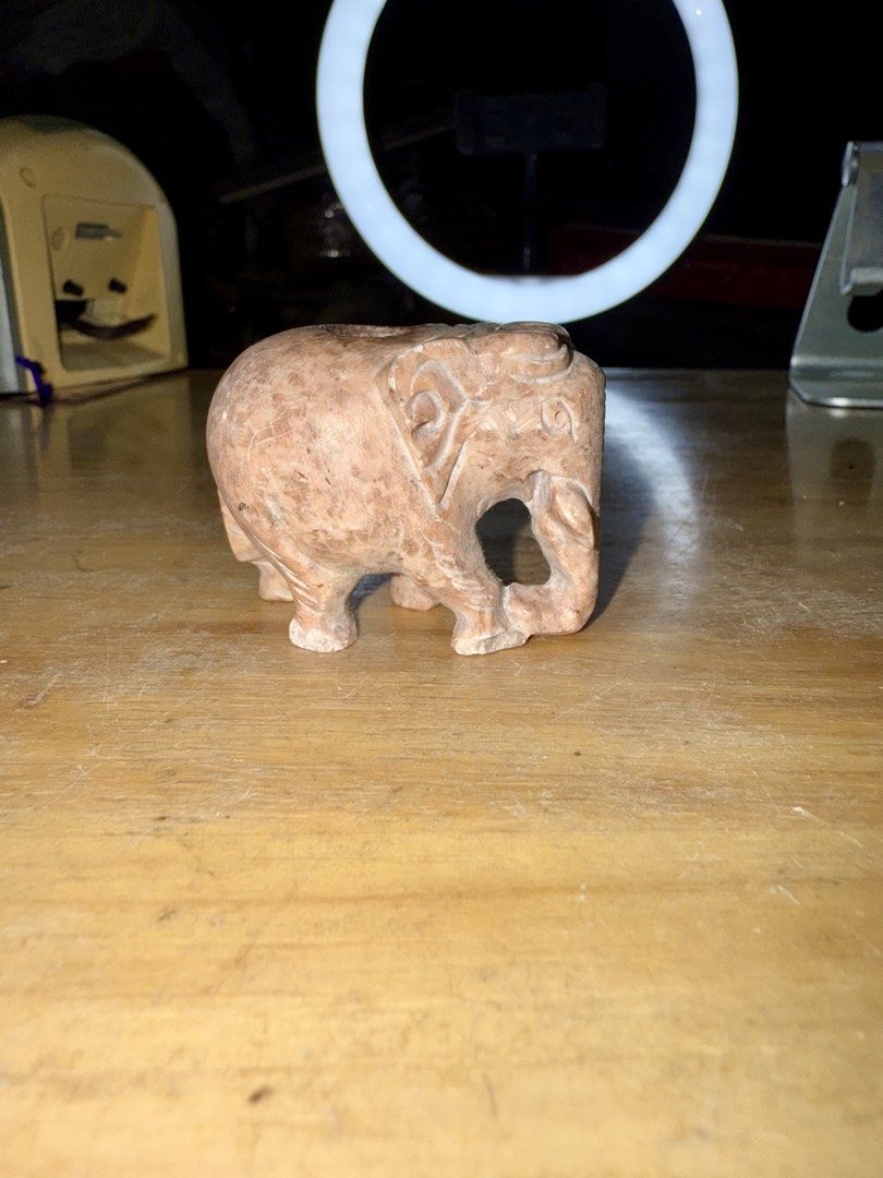Carved Stone Elephant Figurine (Category: Other Home Decor) located in Pilar. Submitted by faveanyshop (Listing ID 1461354922, Image 1). Description: - Adorable stone elephant carving - Intricate details on trunk and ears - Small hollowed-out section on its back - Perfect for shelf or desk display - Adds charm to any space.