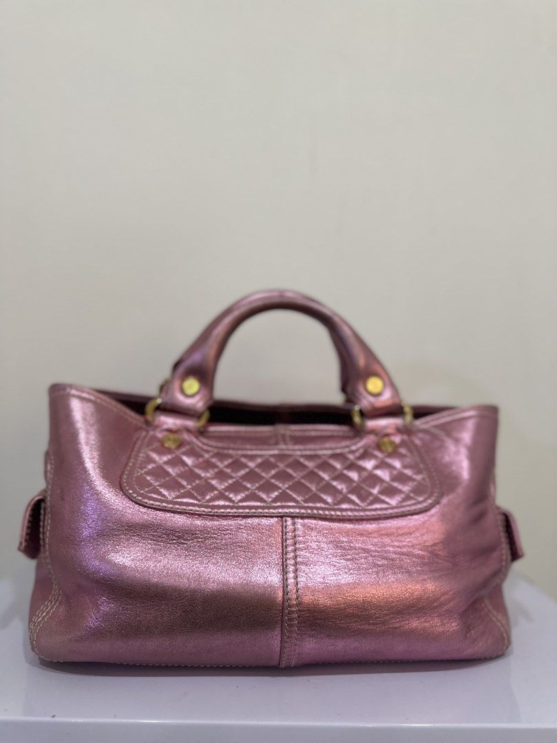 Celine Metallic Pink Leather Handbag (Category: Luxury Bags & Wallets) located in Malabon City. Submitted by everythingpreloveddd (Listing ID 1461376120, Image 3). Description: - Metallic pink leather handbag - Quilted detailing on the front - Small pocket on the back - Gold-tone hardware with CELINE zipper pulls - Top handles for carrying - Stylish and perfect for everyday use.