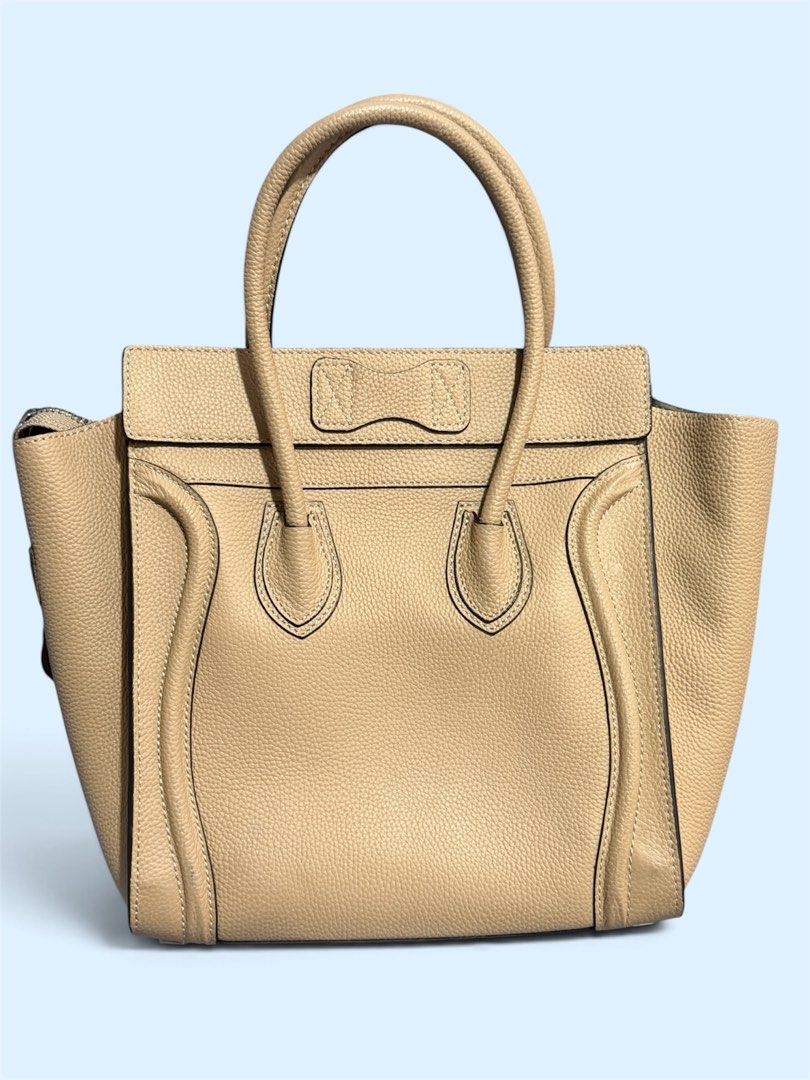 Celine micro Luggage Tote Bag Beige Leather (Category: Luxury Bags & Wallets) located in Quezon City. Submitted by MissusB (Listing ID 1461426789, Image 2). Description: Bought from japan items seller. Self authenticate - Celine Micro Luggage tote - Color: Beige - Material: Pebbled leather - Made in Italy - Features: Front zip pocket, top handles, interior zip and slip pockets - Dimensions: Approx. 10" W x 10"H x 5"D - Includes: Dust bag Slightly
