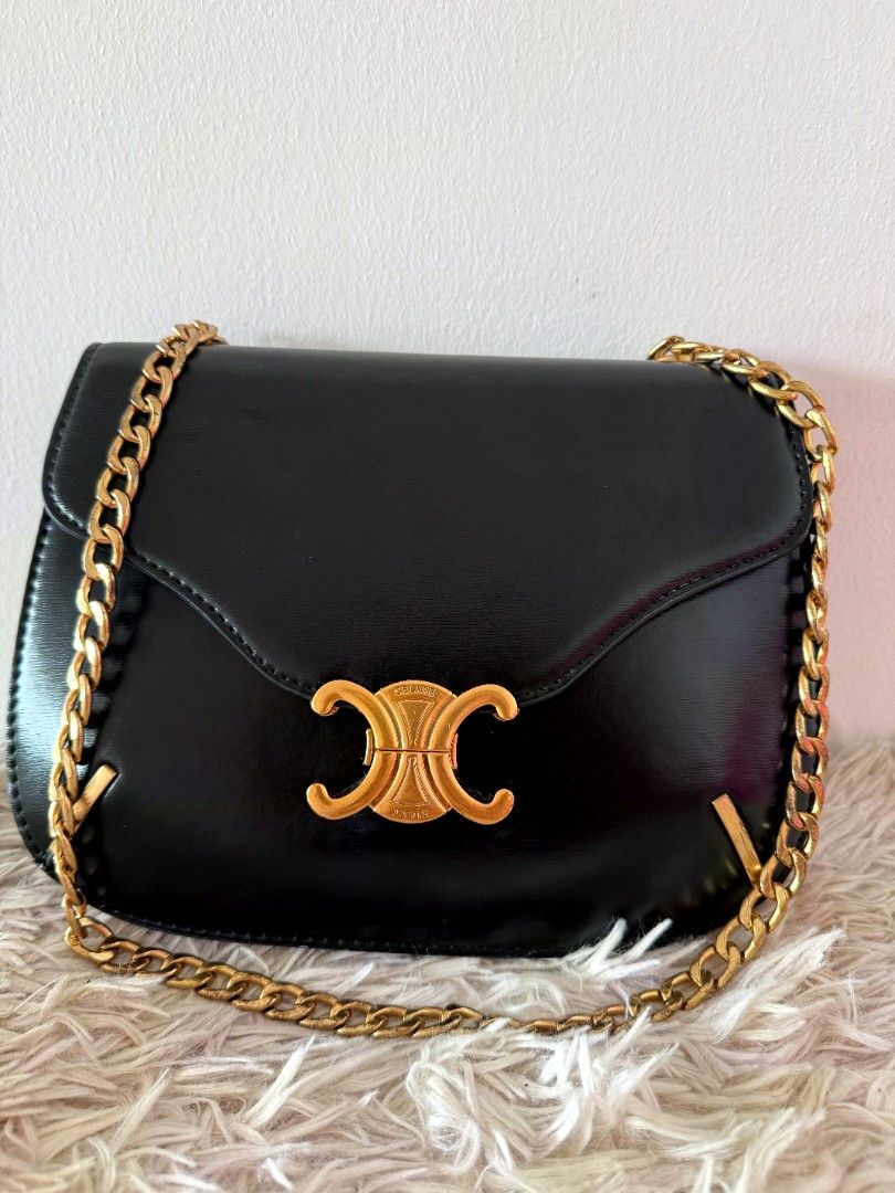 Celine Triomphe Bag Black Leather Gold Chain (Category: Shoulder Bags) located in Caloocan City. Submitted by mylove326 (Listing ID 1461438014, Image 1). Description: - Black Leather Celine Bag - Iconic Gold Triomphe Clasp - Elegant Gold Chain Strap - Structured, Timeless Shape - Versatile: Dress Up or Down - Fits Your Daily Essentials.
