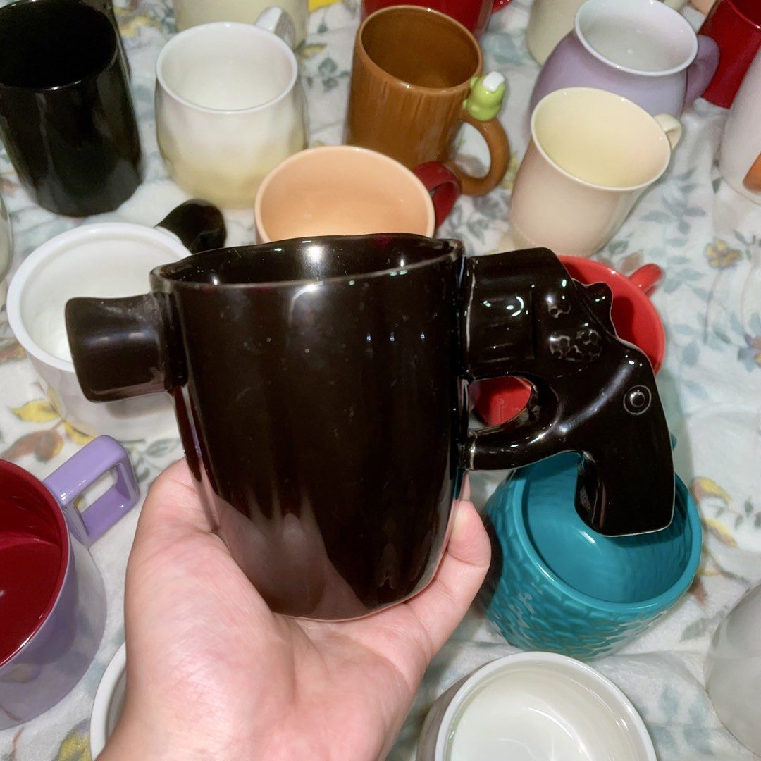 Ceramic Black Gun Design (Category: Other Kitchenware & Tableware) located in Valenzuela. Submitted by baekhyunie_pau (Listing ID 1461560160, Image 1). Description: Black ceramic mug with gun design handle. Unique and stylish. Durable ceramic material..