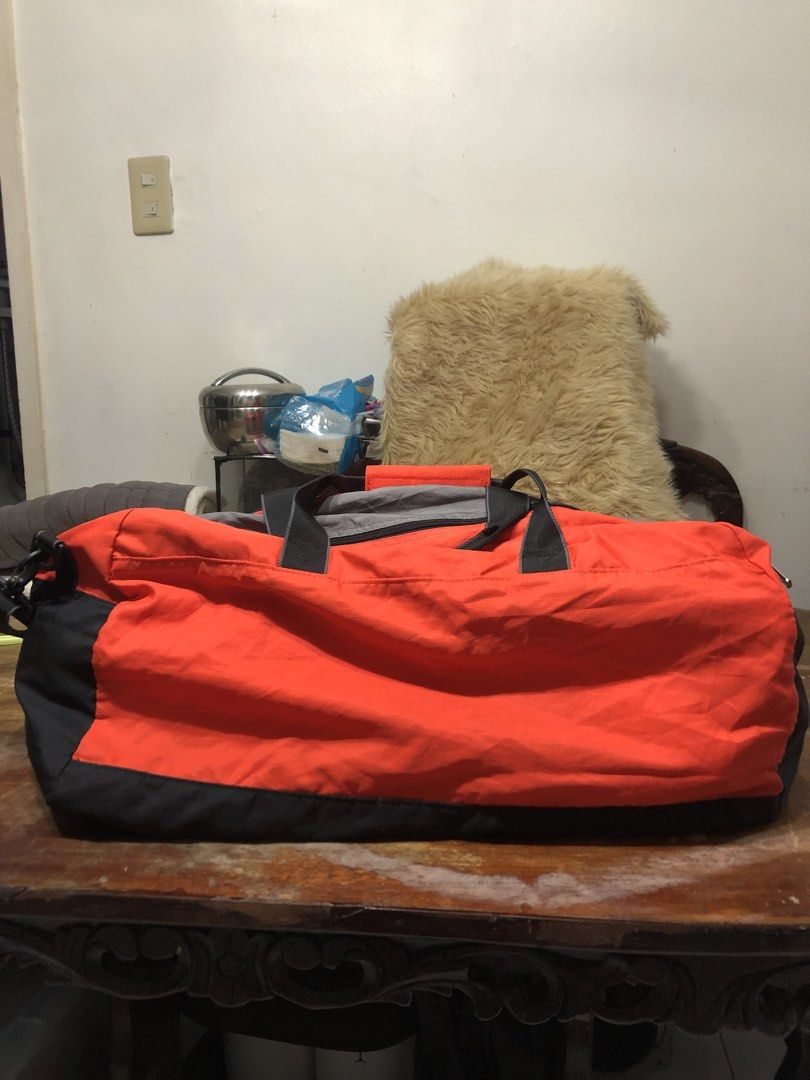 Champion Duffel Bag (Category: Other Sports Equipment and Supplies) located in Quezon City. Submitted by bettymeir07 (Listing ID 1461539564, Image 2). Description: Authentic Champion large travel, sports, and gym duffel bag, featuring a classic orange, black, and gray color-blocked panel design. -In good condition -PRICE NEGOTIABLE MOP: GOTYME or GCASH.