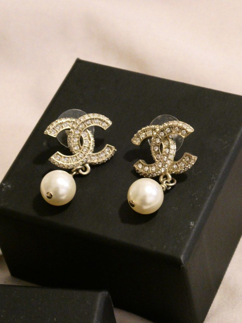 Chanel CC Pearl Drop Earrings (Category: Earrings) located in Quezon City. Submitted by shopwithfrance (Listing ID 1461548280, Image 3). Description: - Authentic Chanel earrings - Iconic CC logo with pearl drops - Includes original Chanel box and pouch .