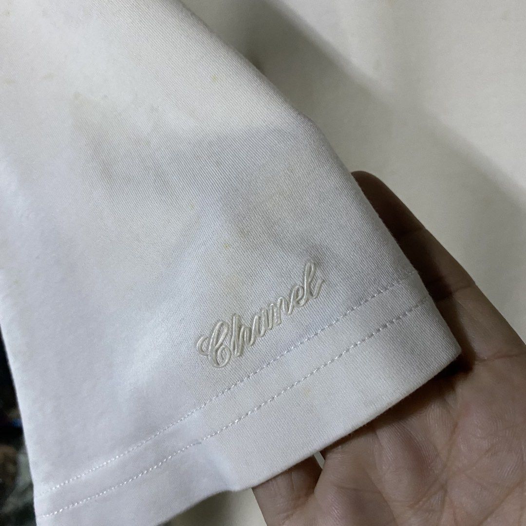 Chanel Uniform Small Embroidered Logo Shirt (Category: Luxury Apparel) located in Baguio. Submitted by goodfinds2600v2 (Listing ID 1461518526, Image 3). Description: Size on tag: L Dimensions: L-26.5 W/Bust-21.5 Description: unisex Condition: Good Issue/s: stains, needs deep cleaning .