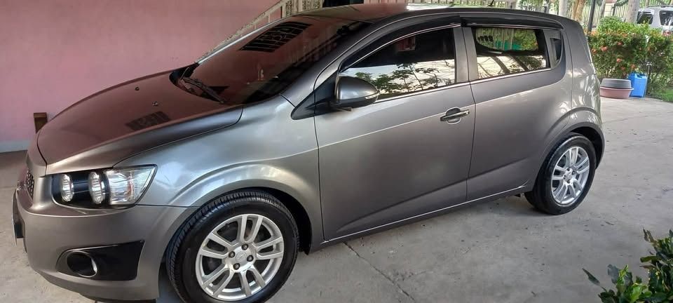 Chevrolet Sonic 1.4 LTZ Hatchback (A) (Category: Used Cars) located in Caloocan City. Submitted by arki_lou.horse (Listing ID 1461415131, Image 2). Description: PTPA: For Sale Chevrolet Sonic LTZ FULL OPTION 2015 Model- HatchBack. Location: Lubao Pampanga ,Slightly Negotiable upon Viewing for Serious Buyers only. -1st Owner, Reason for Selling: Living in Abroad. -Low Mileage- 48,243 km. -1.4 liter Engine, Double overhead cam (DOHC), 16 valve. -6 
