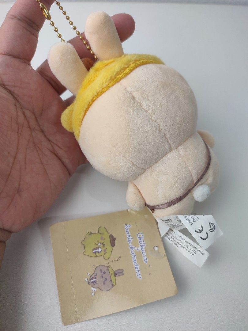 Chiikawa Sanrio Characters Plush Toy Keychain (Category: Plushies & Soft Toys) located in Manila. Submitted by epicmountain-f20453 (Listing ID 1461515202, Image 2). Description: - Adorable Chiikawa plush toy with attached keychain. - Hippers not included. - Includes a handy little pouch on the front. - Comes with a bonus smaller matching bunny charm. - Ideal for decorating bags, backpacks, or as a keychain. - Authentic Sanrio product..