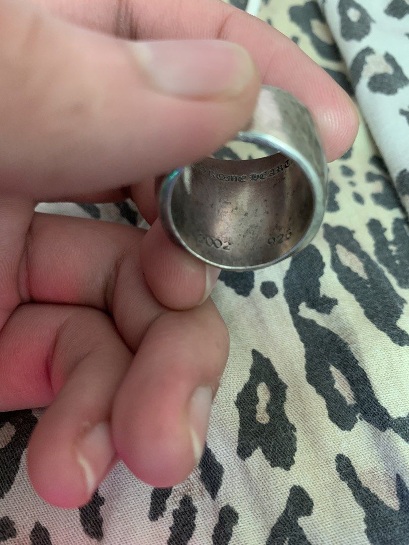 Chrome Hearts Ring 925 Silver 2002 (Category: Rings) located in Manila. Submitted by vintaurafindsco. (Listing ID 1461369354, Image 2). Description: - Authentic Chrome Hearts Ring - Material: 925 Sterling Silver - Year: 2002 - Design: Classic cross with a small pearl detail - Condition: Shows some signs of wear, still looks good - Ideal for: Collectors.