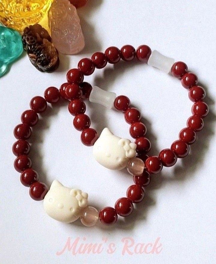 CINNABAR AND WHITE CHALCEDONY WITH HELLO KITTY CHARM (Category: Bracelets) located in Taguig. Submitted by mimisrack (Listing ID 1461559181, Image 1). Description: ❤️Sweet protection energy with a cute, joyful charm for everyday luck and positivity -Cinnabar is known in feng shui traditions as a stone of protection, wealth attraction, and powerful life-force energy -White Chalcedony promotes calm emotions, gentle healing, and peaceful communicati