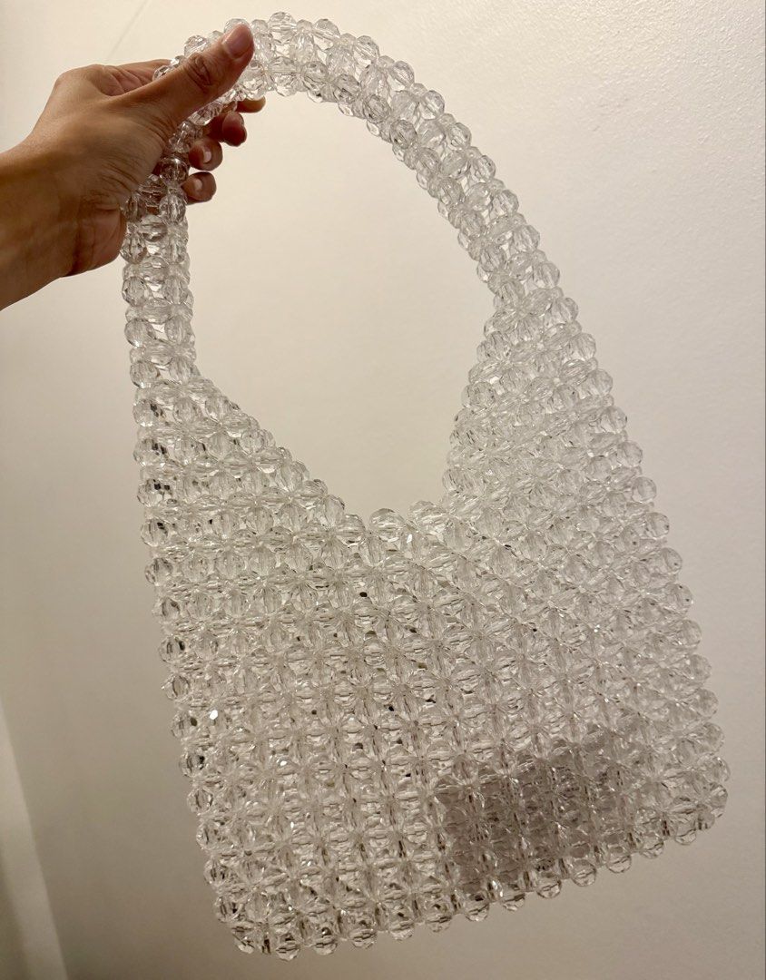 Clear Beaded Shoulder Bag (Category: Shoulder Bags) located in Quezon City. Submitted by sabinalopez821 (Listing ID 1461482159, Image 1). Description: - Cute clear beaded shoulder bag - Perfect for going out or casual days - Features a nice sparkle from the clear beads - Good size for your essentials - Easy to carry.