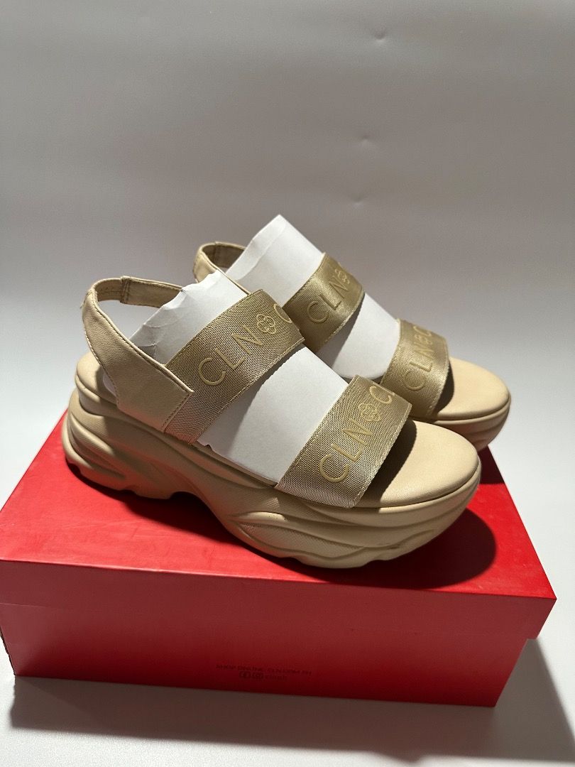 CLN Beige Platform Sandals with Gold Logo Straps (Category: Sandals) located in Calamba. Submitted by daisy214 (Listing ID 1461541032, Image 2). Description: - Brand: CLN - Color: Beige - Style: Platform Sandals - Features: Gold logo straps across the front, chunky sole for comfort and style - Condition: Comes with original CLN box - Occasion: Great for casual wear.