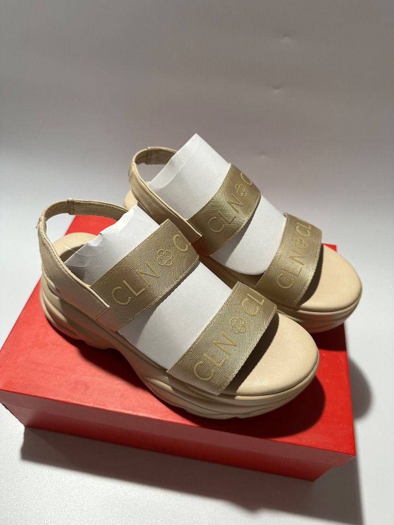CLN Beige Platform Sandals with Gold Logo Straps (Category: Sandals) located in Calamba. Submitted by daisy214 (Listing ID 1461541032, Image 1). Description: - Brand: CLN - Color: Beige - Style: Platform Sandals - Features: Gold logo straps across the front, chunky sole for comfort and style - Condition: Comes with original CLN box - Occasion: Great for casual wear.