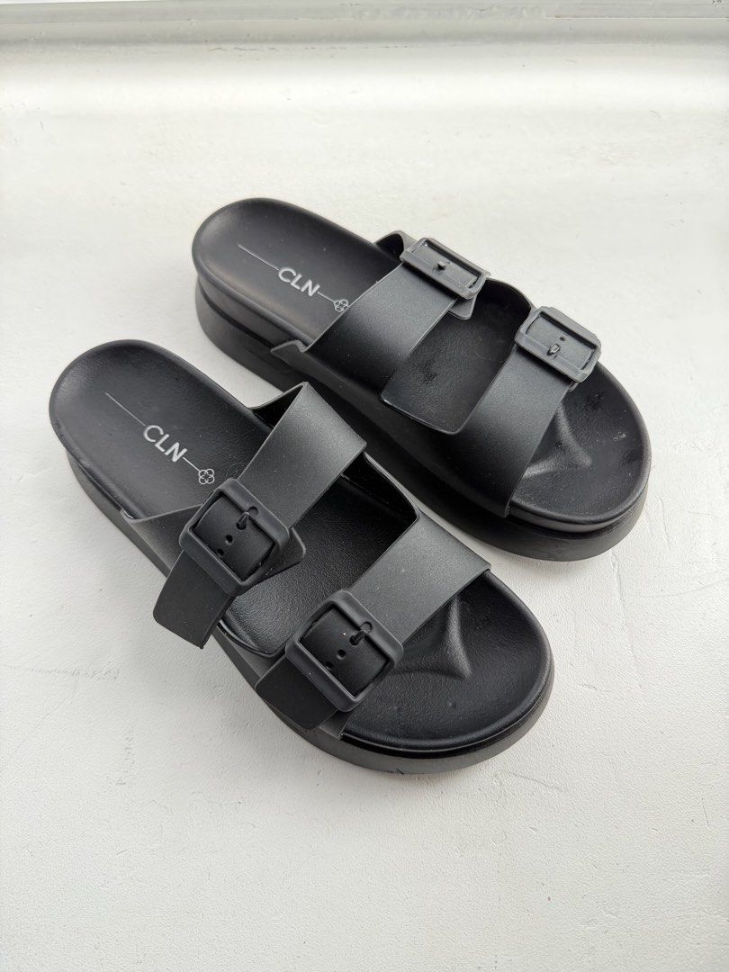 CLN Black Double Strap Platform Slides (Category: Flats & Sandals) located in Pasig City. Submitted by yoroshikuonegaishimasu (Listing ID 1461446598, Image 1). Description: Black CLN slides Adjustable double straps Size: 41 EUR / 8 UK / 10 USA Issue: Need idikit yung mga straps, natanggal na yung dikit Payment via GCash or Paymaya No Meet-up/COD/COP No return, exchange or refund Delivery: Grab or Lalamove J&T (during weekend only) Location: Pasig