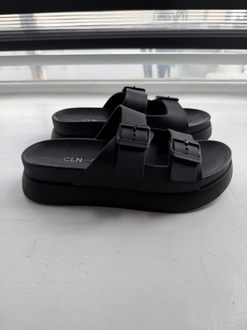 CLN Black Double Strap Platform Slides (Category: Flats & Sandals) located in Pasig City. Submitted by yoroshikuonegaishimasu (Listing ID 1461446598, Image 2). Description: Black CLN slides Adjustable double straps Size: 41 EUR / 8 UK / 10 USA Issue: Need idikit yung mga straps, natanggal na yung dikit Payment via GCash or Paymaya No Meet-up/COD/COP No return, exchange or refund Delivery: Grab or Lalamove J&T (during weekend only) Location: Pasig