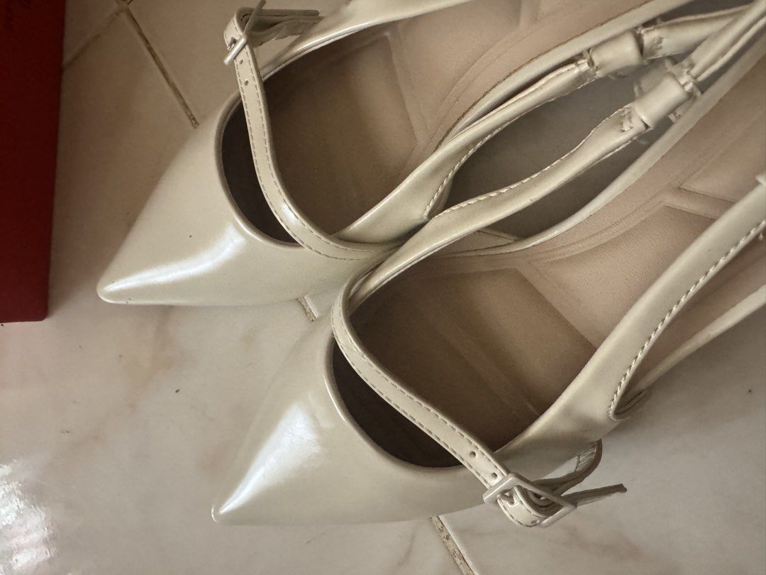 CLN Bone Slingback Heels Size 39 (Category: Heels) located in Bantay. Submitted by erikapgp (Listing ID 1461363101, Image 2). Description: CLN Bone Slingback Heels Size 39 - Elegant bone-colored slingback heels - Stylish pointed toe design - Secure adjustable strap with buckle - Comes with original box - Includes extra heel tips for longevity - Size: 39 - No papers inside Other details: Used only once for a closed-door event. Never worn it anymor