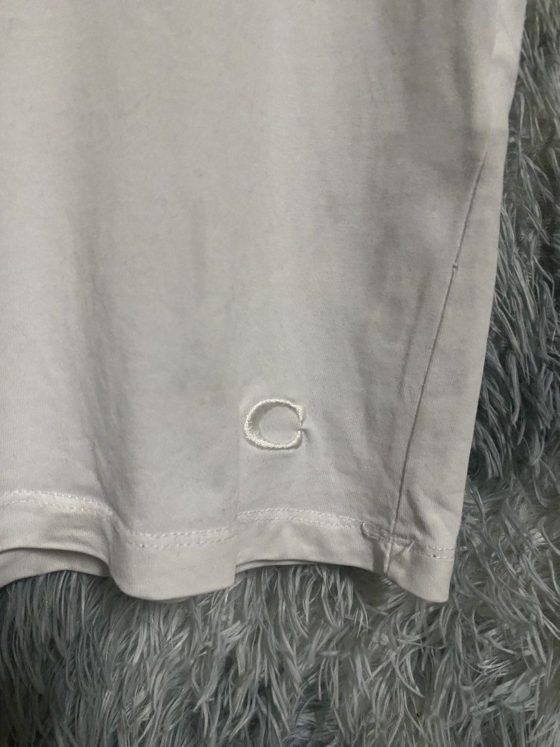 COACH (Category: Tshirts & Polo Shirts ) located in Cavite. Submitted by sammie_jhane (Listing ID 1461527801, Image 3). Description: COACH COMPLETE TAGS GOOD CONDITION/YELLOW STAIN,NECKLINE DIMES WIDTH 19 LENGTH 26 🏷️299+SHIPPING FEE DASMARIÑAS CAVITE LOC.