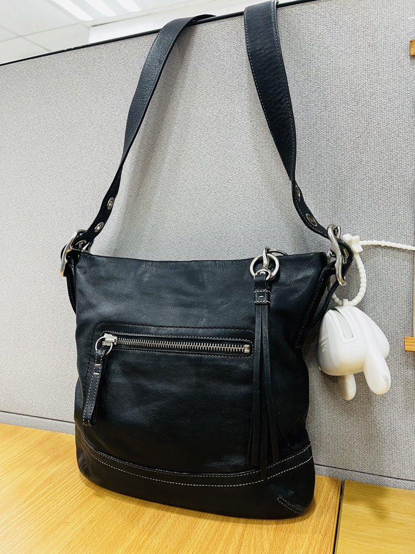 Coach Black Leather Hobo Shoulder Bag (Category: Luxury Bags & Wallets) located in Pasig City. Submitted by zen_it_all (Listing ID 1461368883, Image 1). Description: - Authentic leather Coach hobo bag - Elegant white stitching details - Convenient front zip pocket - Secure main zip closure - Adjustable shoulder strap for comfort - charm not included - Ideal everyday bag. / can be unisex - flaws: upper lip portion / zipper puller (but overall cond