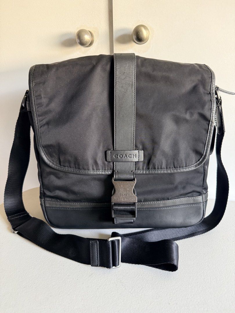 Coach Black Nylon Leather Messenger Bag (Category: Luxury Bags & Wallets) located in Valenzuela. Submitted by dees.corner (Listing ID 1461425412, Image 1). Description: - Authentic Coach messenger bag - Durable nylon material with stylish leather trim - Secure buckle closure on the front flap - Adjustable shoulder strap for comfortable carrying - Includes original leather Coach tag - Ideal for everyday errands or travel adventures Coach Mens Blac