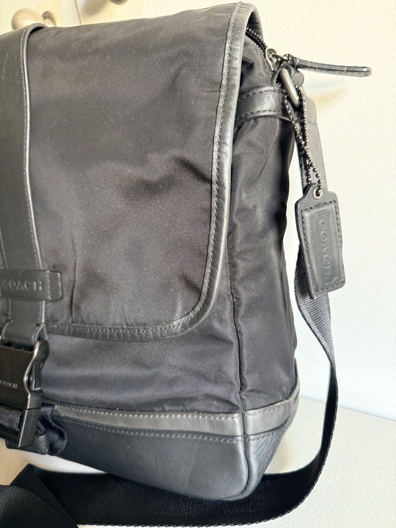 Coach Black Nylon Leather Messenger Bag (Category: Luxury Bags & Wallets) located in Valenzuela. Submitted by dees.corner (Listing ID 1461425412, Image 3). Description: - Authentic Coach messenger bag - Durable nylon material with stylish leather trim - Secure buckle closure on the front flap - Adjustable shoulder strap for comfortable carrying - Includes original leather Coach tag - Ideal for everyday errands or travel adventures Coach Mens Blac