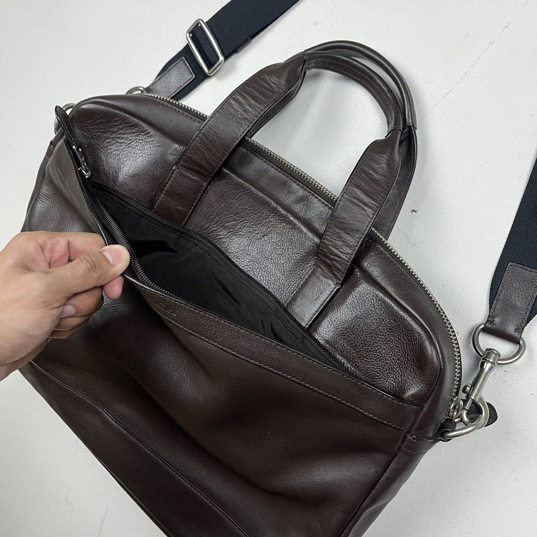 Coach Hamilton Dark Brown Pebbled Leather 2-Way Briefcase (Category: Luxury Bags & Wallets) located in Quezon City. Submitted by forgarments (Listing ID 1461531916, Image 3). Description: Coach Hamilton Dark Brown Pebbled Leather 2-Way Briefcase Excellent Condition / Care card Width: 39 Cm Height: 28.5 Cm Depth: 7 Cm Handle: 12 Cm A modern business staple from Coach New York, crafted from supple dark brown full-grain pebbled leather with tonal st