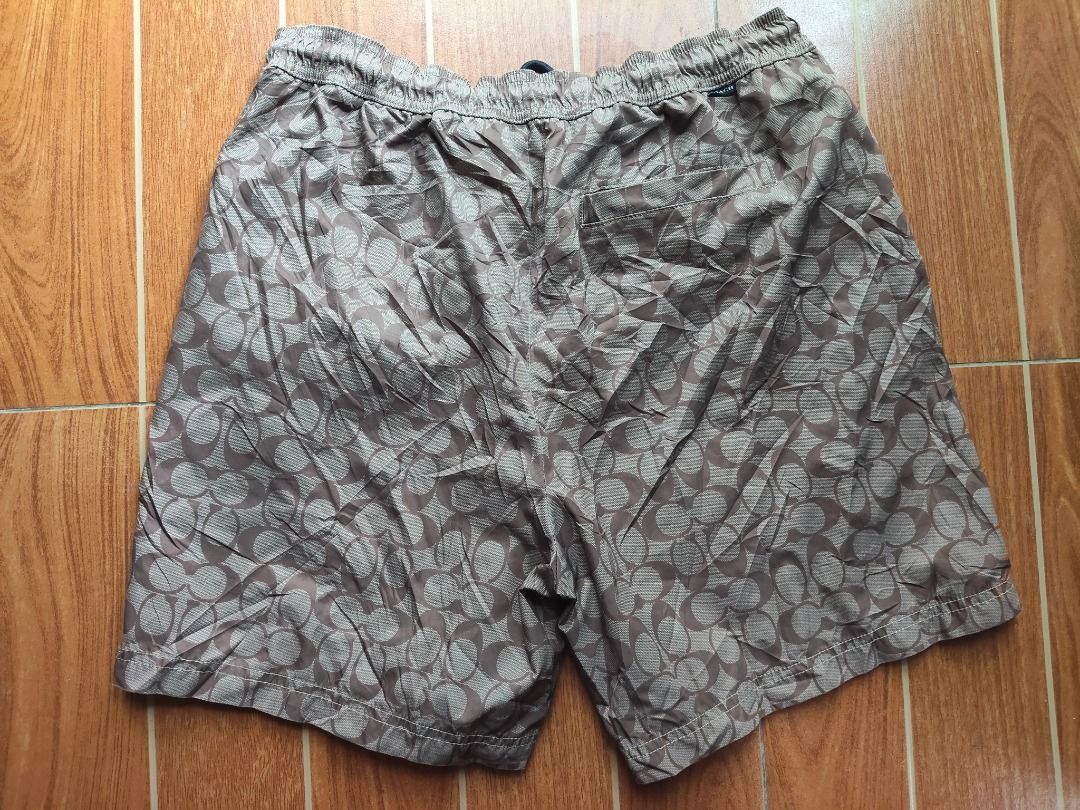 Coach Men's Patterned Swim Shorts (Category: Shorts) located in Caloocan City. Submitted by balizaclar77072 (Listing ID 1461426951, Image 2). Description: - Stylish Coach swim shorts with a cool all-over pattern. - Comfortable elastic waistband with adjustable drawstring. - Features a built-in mesh lining. - Ideal for beach days or poolside lounging. - Made in China. Please check photos for condition..