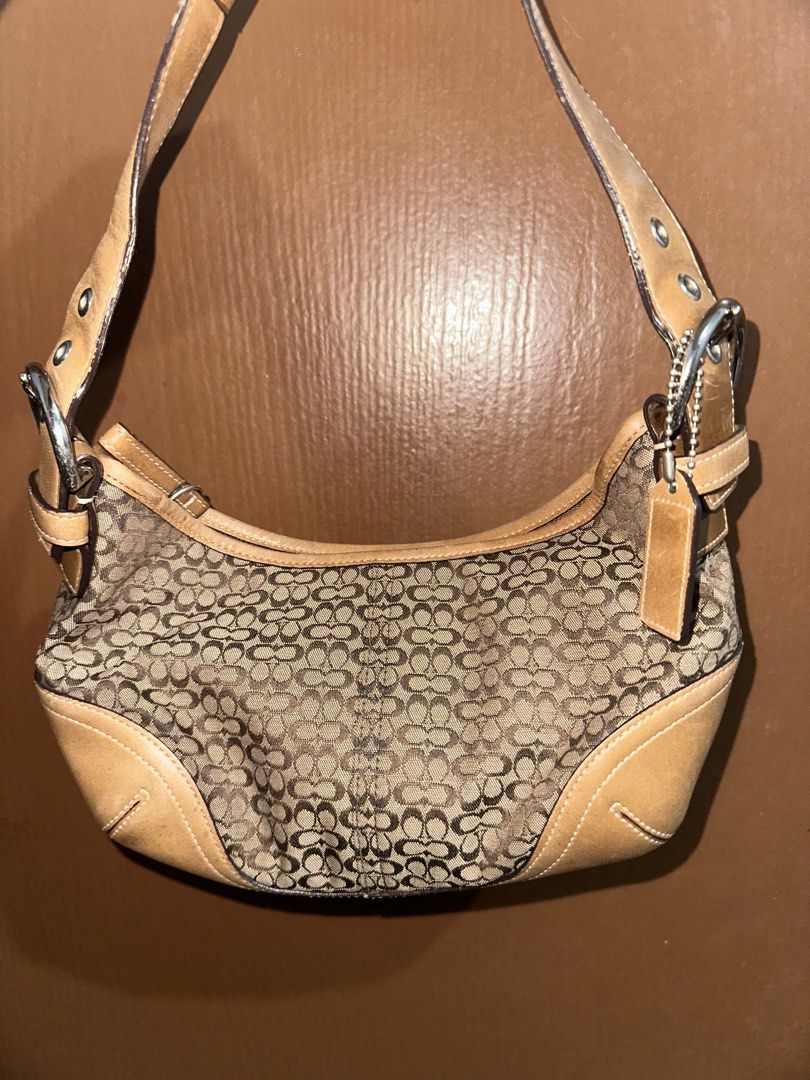 Coach Mini Hobo (Category: Luxury Bags & Wallets) located in Mandaue City. Submitted by valeryoneus (Listing ID 1461463389, Image 1). Description: - Classic Coach shoulder bag - Signature monogram canvas with tan leather trim - Adjustable strap with buckle details - Ideal for everyday use Open for layaway. Transaction in blue app for sure buyers.