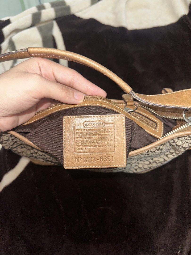 Coach Mini Hobo (Category: Luxury Bags & Wallets) located in Mandaue City. Submitted by valeryoneus (Listing ID 1461463389, Image 3). Description: - Classic Coach shoulder bag - Signature monogram canvas with tan leather trim - Adjustable strap with buckle details - Ideal for everyday use Open for layaway. Transaction in blue app for sure buyers.