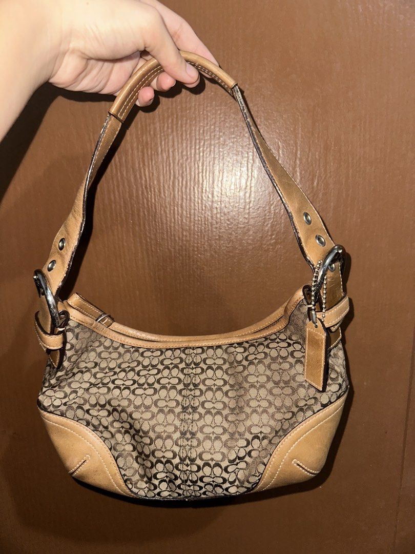 Coach Mini Hobo (Category: Luxury Bags & Wallets) located in Mandaue City. Submitted by valeryoneus (Listing ID 1461463389, Image 2). Description: - Classic Coach shoulder bag - Signature monogram canvas with tan leather trim - Adjustable strap with buckle details - Ideal for everyday use Open for layaway. Transaction in blue app for sure buyers.