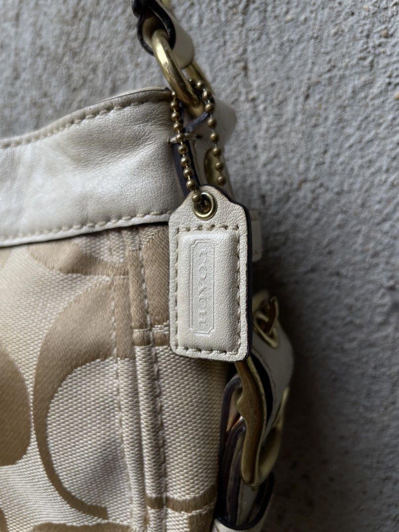 Coach Monogram Canvas Leather Trim Shoulder Bag (Category: Luxury Bags & Wallets) located in Guihulngan. Submitted by johnrealvi59756 (Listing ID 1461330548, Image 3). Description: - Classic Coach shoulder bag - Beige canvas with signature 'C' monogram - Cream leather trim and strap - Gold-tone hardware - Small size, perfect for essentials.