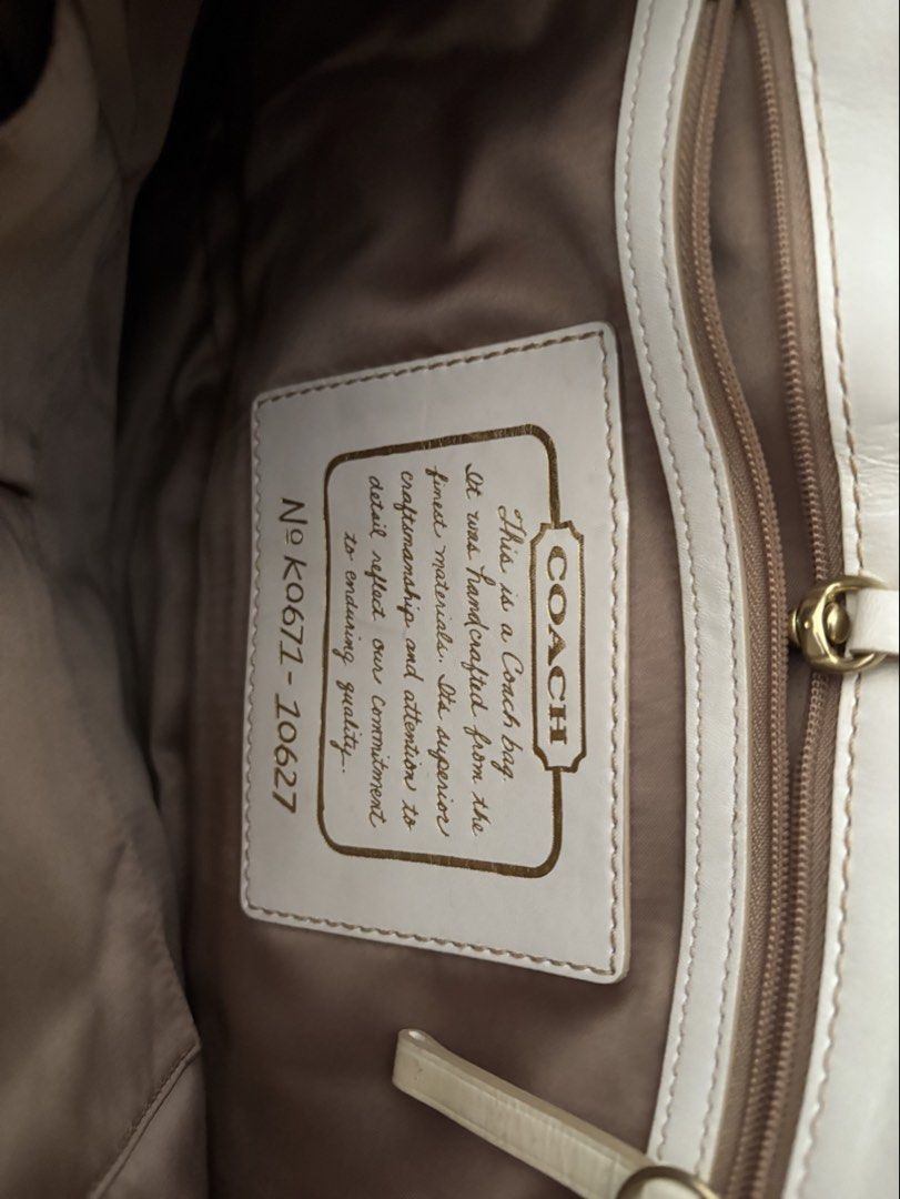 Coach Monogram Canvas Leather Shoulder Bag (Category: Luxury Bags & Wallets) located in San Pedro. Submitted by maria_xoxo (Listing ID 1461411918, Image 3). Description: - Authentic Coach monogram shoulder bag - Classic brown and white colorway - White leather strap and trim - Interior: 1 zippered pocket, 1 slip pocket - Gold hardware - Plenty of life left, great pre-loved condition.